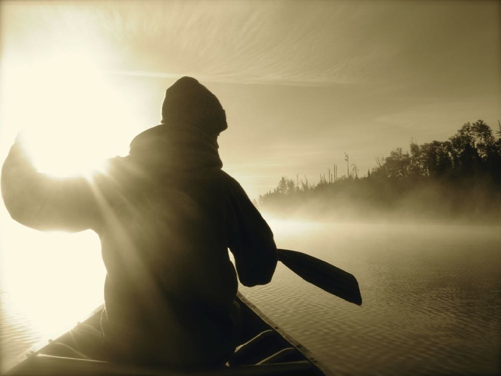 canoeist at sunrise