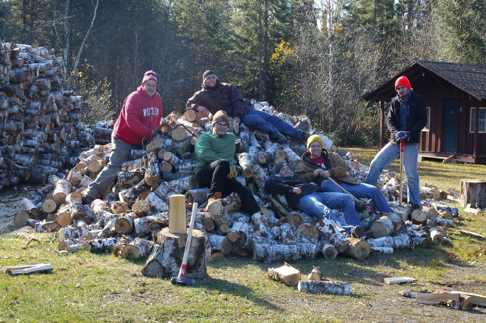 several men on a woodpile