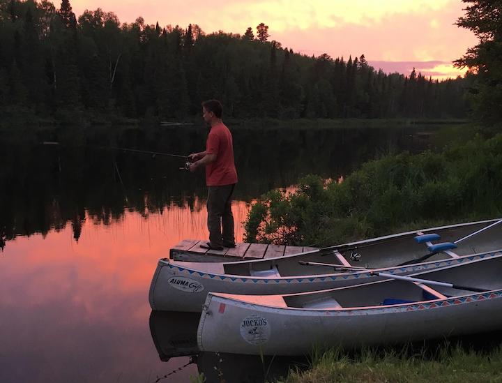 man fishing off a dock