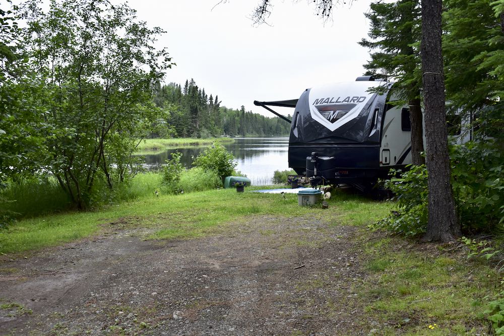 RV at a lakeside campsite