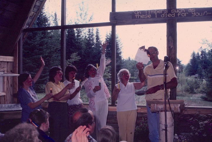 men and women celebrating Okontoe chapel dedication and burning the mortgage