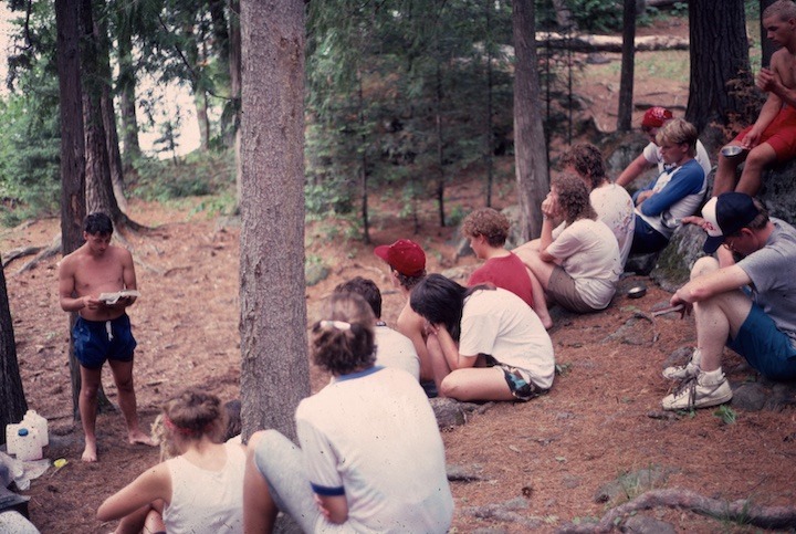 DC campers sitting in the trees listening to a speaker