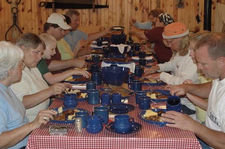 a long table full of people eating