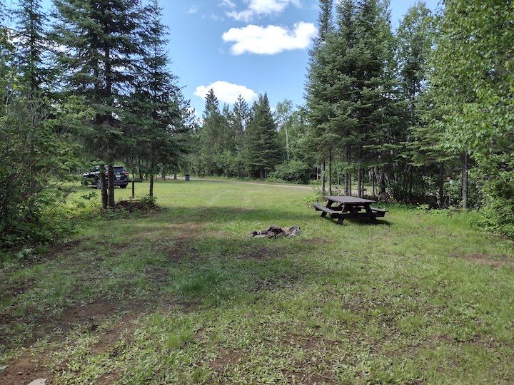 Campsite 20, other view towards campground road, with firepit and picnic table