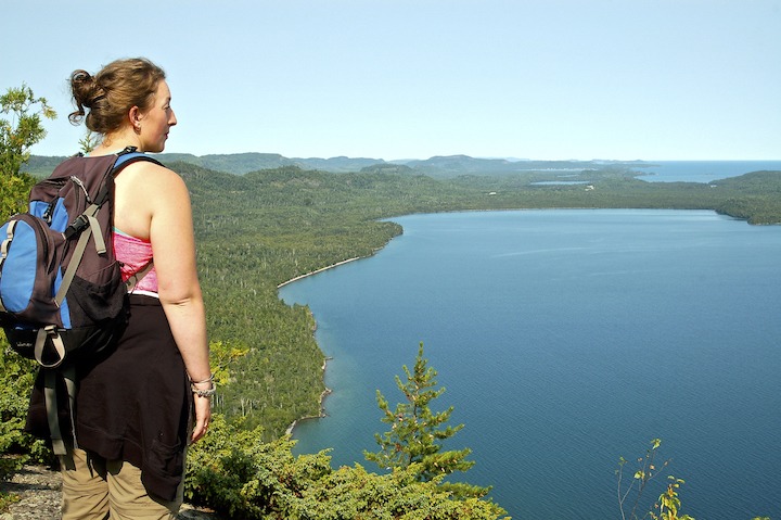 woman overlooking lake superior from Mt Josephine