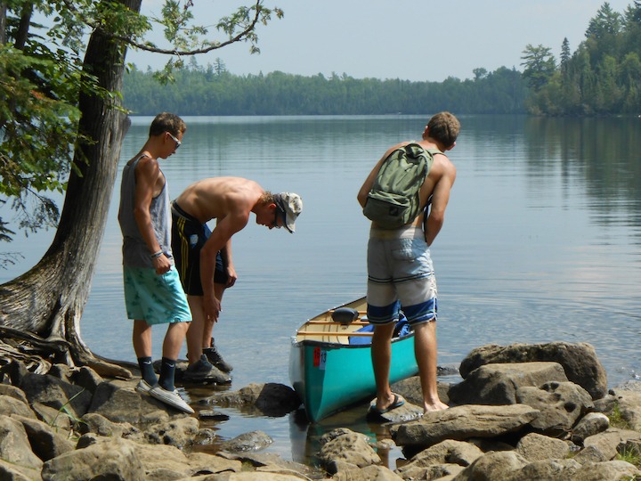 3 teen boys at the portage on West Bearskin Lake