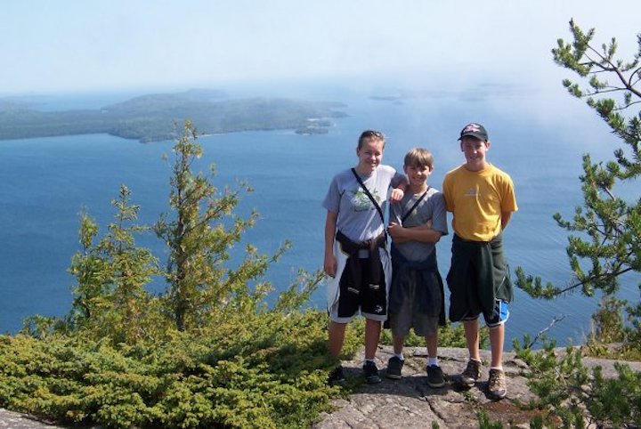 three kids post overlooking lake superior and the susie islands