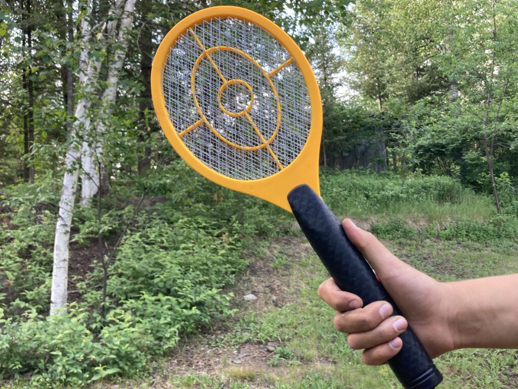 Person holding bug zapper