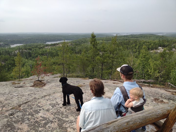 family hike at Blueberry Hill, Gunflint Trail - mom, dad, baby in backpack and dog