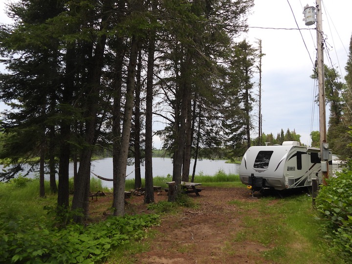small RV at a lakeside Okontoe campsite