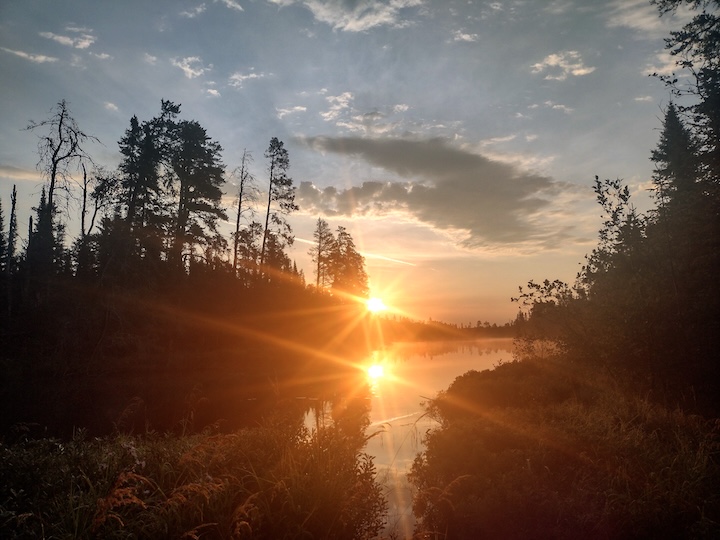 sunrise reflection on Quiver Lake at Okontoe