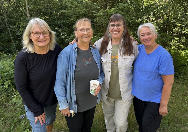 the four leaders of the women's group stand together